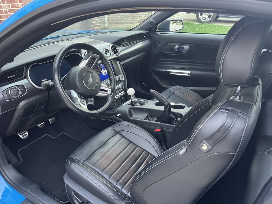 Mustang Mach 1 interior after Signature Shine detail — clean leather seats and dashboard