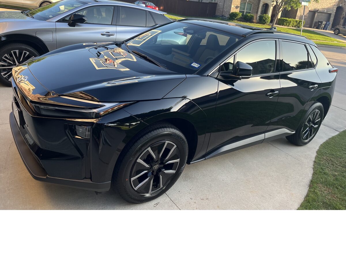 Black Toyota BZ4X with mirror-shine ceramic finish after detail